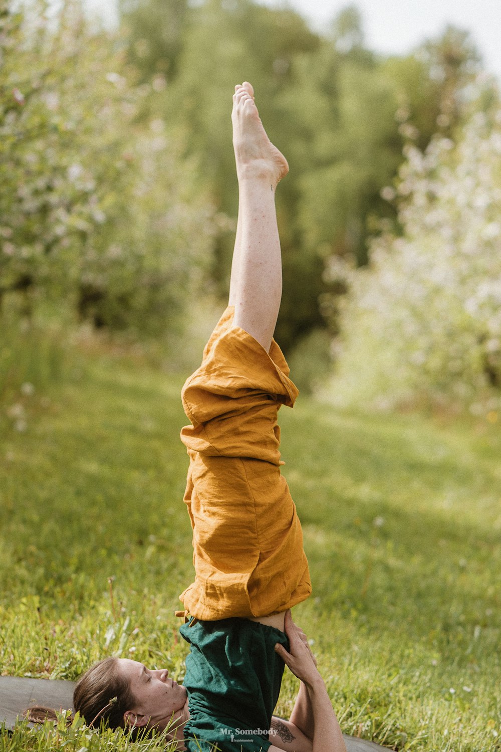 a person doing a handstand