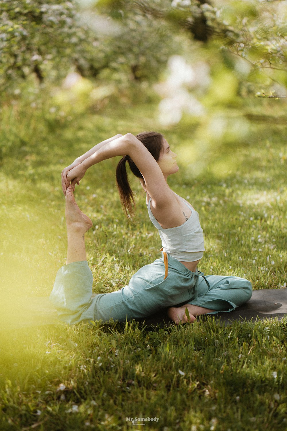 a person sitting on grass