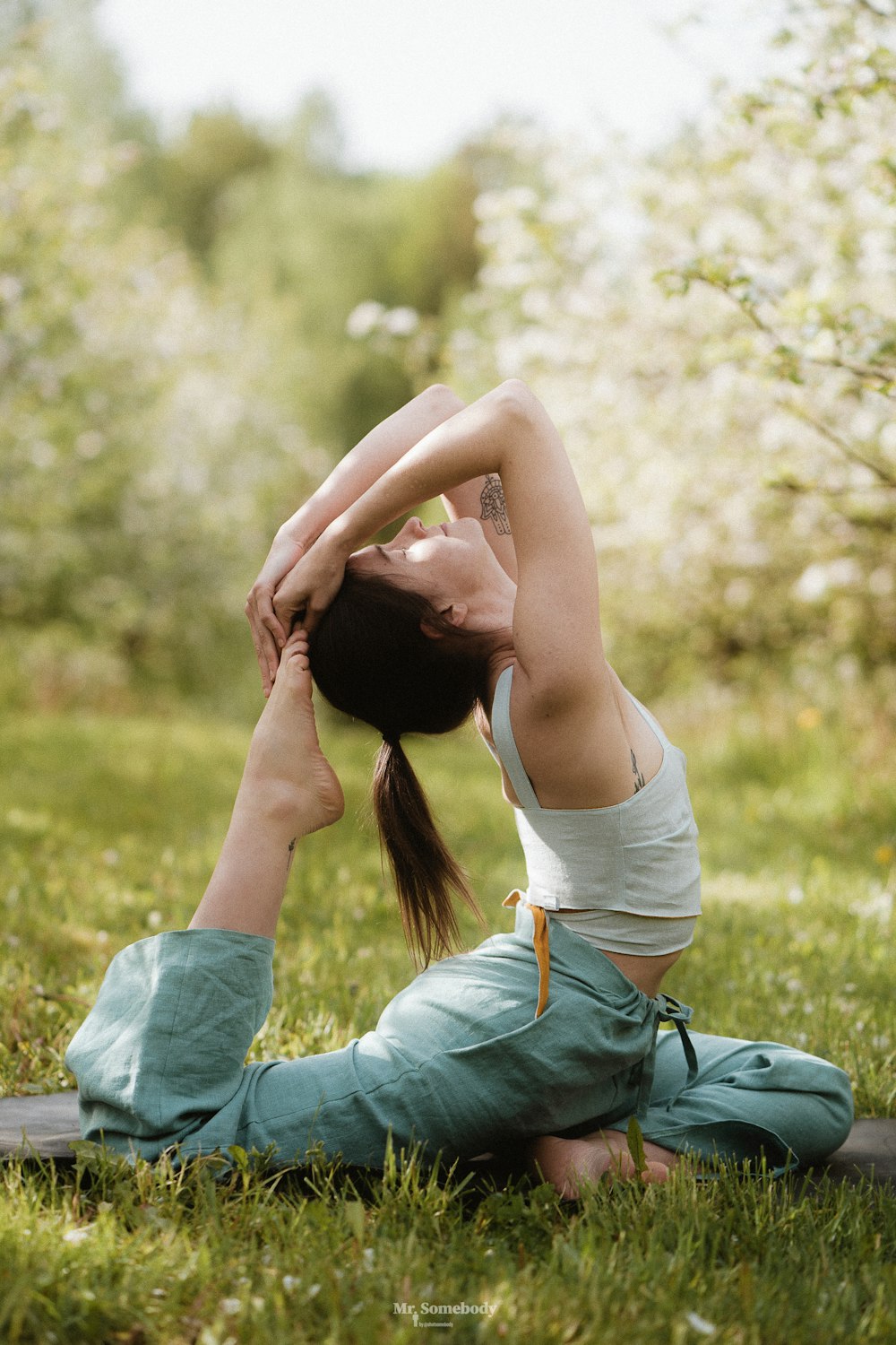 a man doing yoga outside