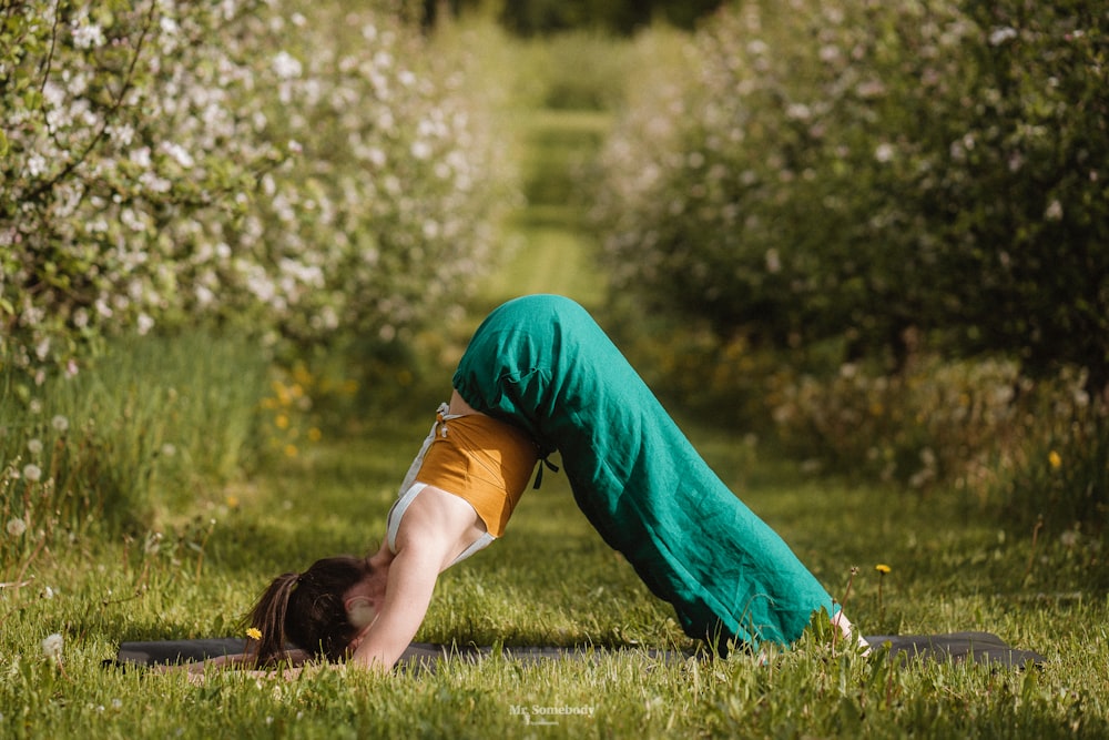 a person lying on the back in the grass