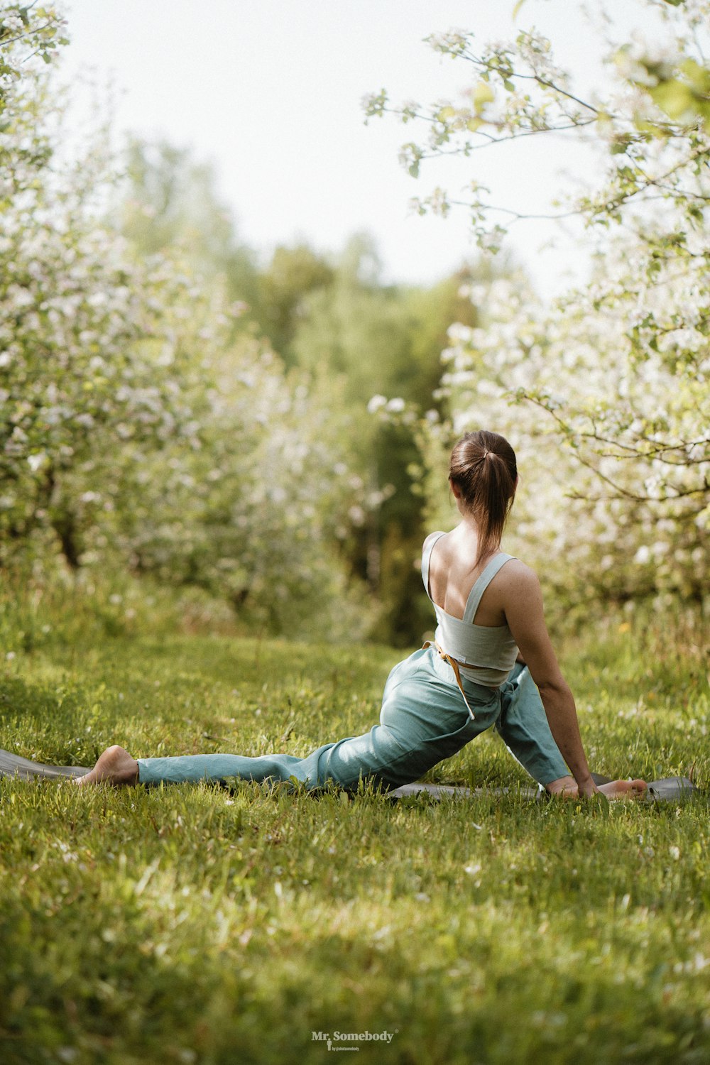 a person sitting on grass