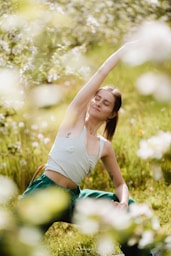 a woman lying in the grass