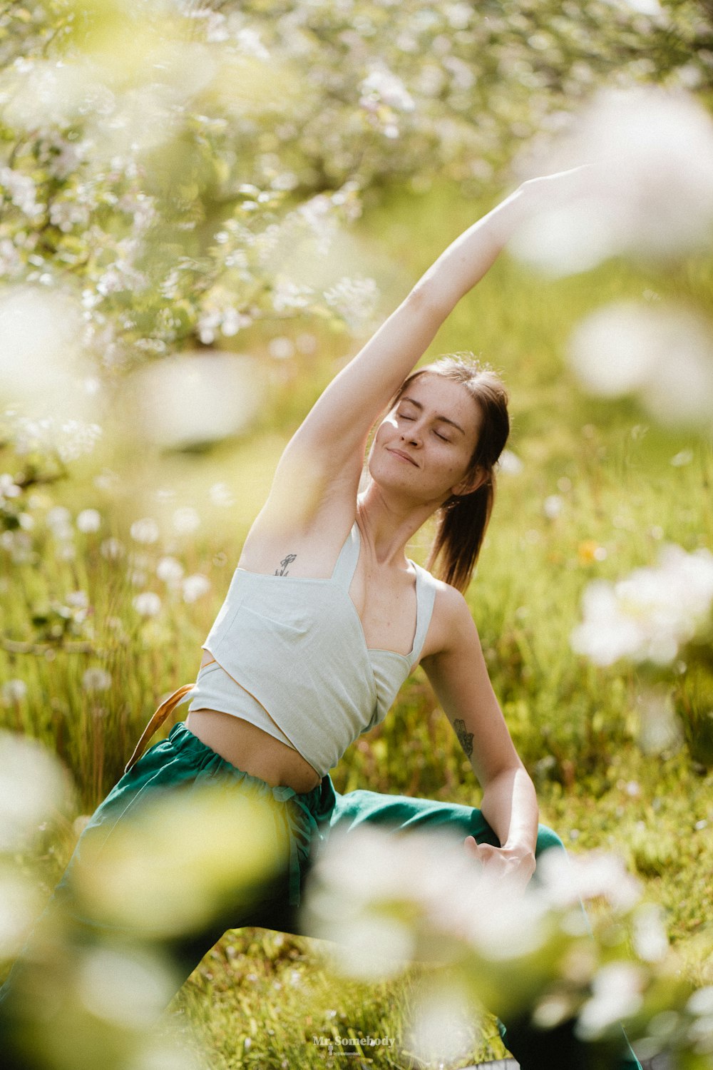 a woman lying in the grass