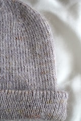 A cozy knitted beanie in soft wool, perfect for chilly days.