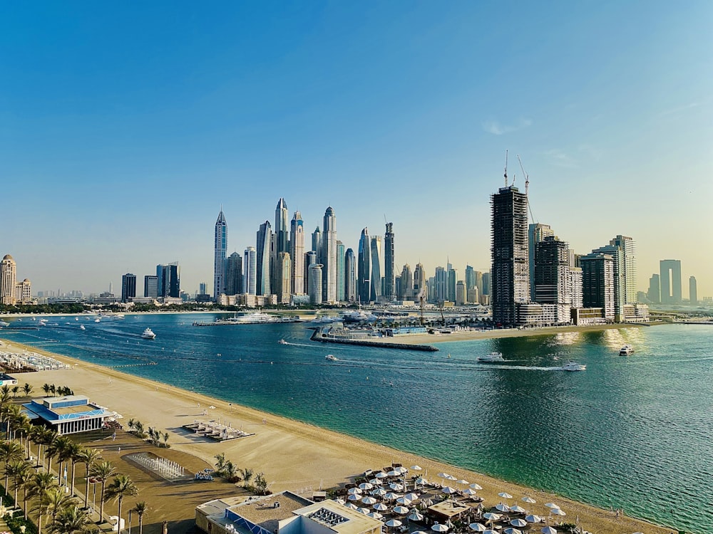 a city skyline with a beach and water