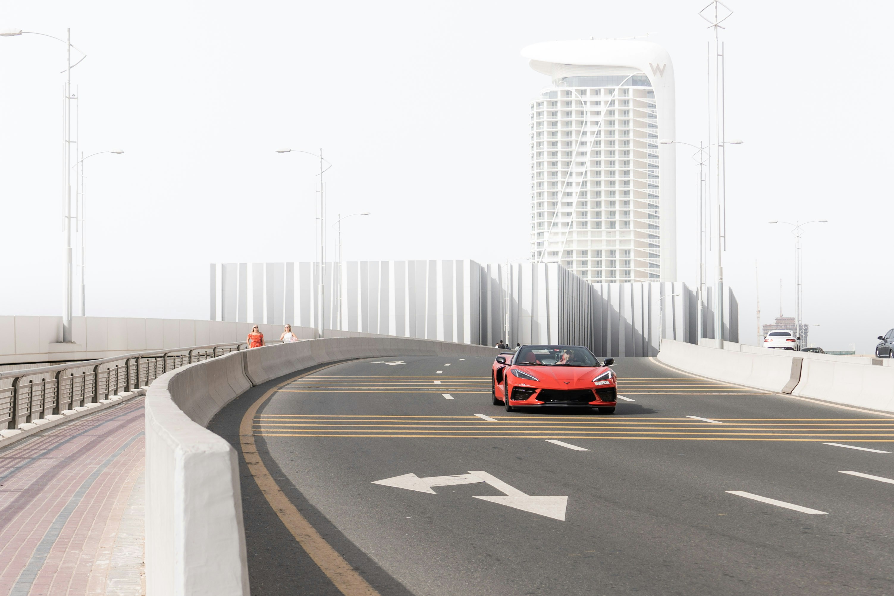 Tesla Model 3 electric sedan driving on a city street