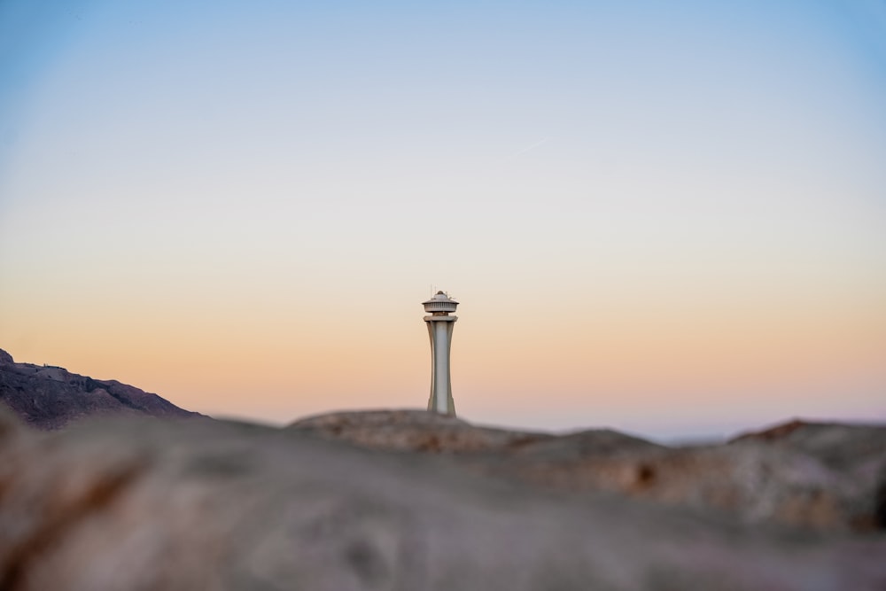 a lighthouse on a hill