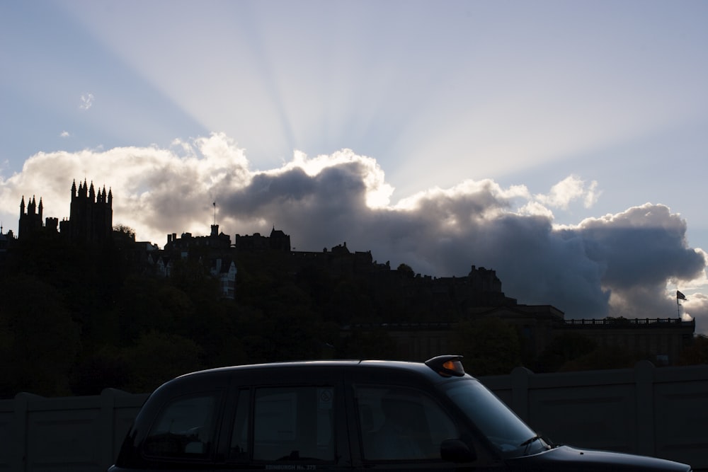 a car parked in front of a city