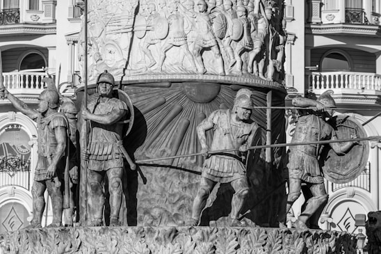 A detailed Roman military camp bustling with legionnaires preparing for battle at dawn.