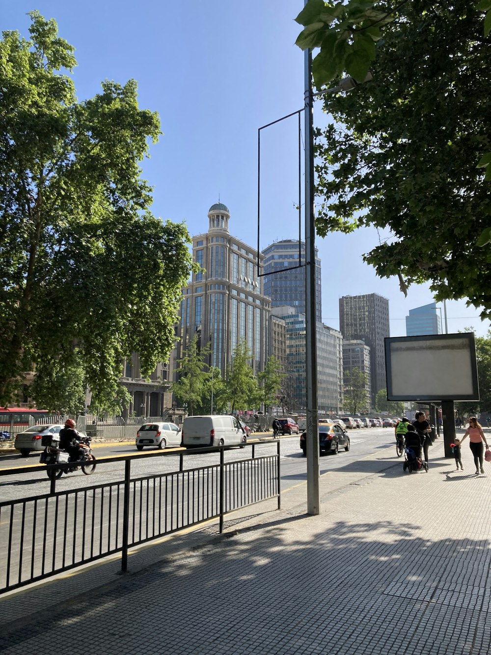 a city street with people and cars