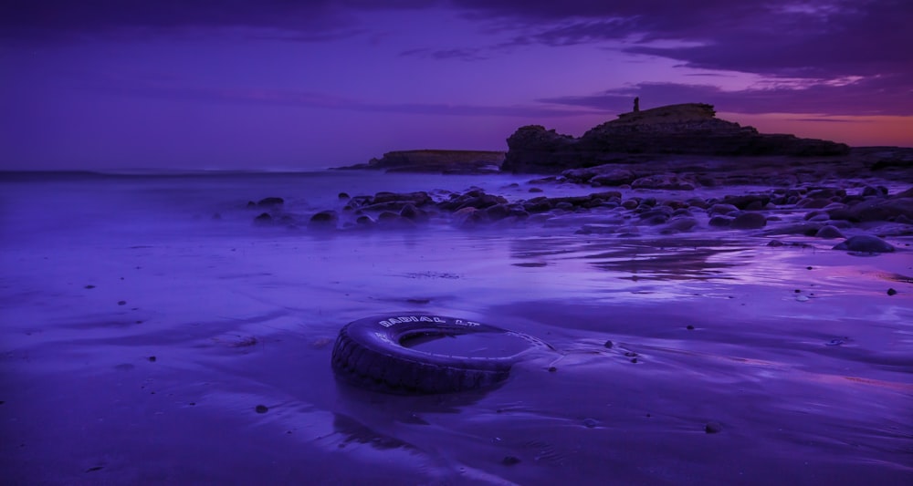 a tire on a beach