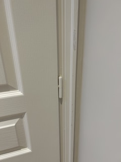An assortment of door hinges in different sizes and finishes.