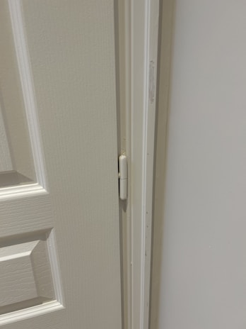 An assortment of door hinges in different sizes and finishes.