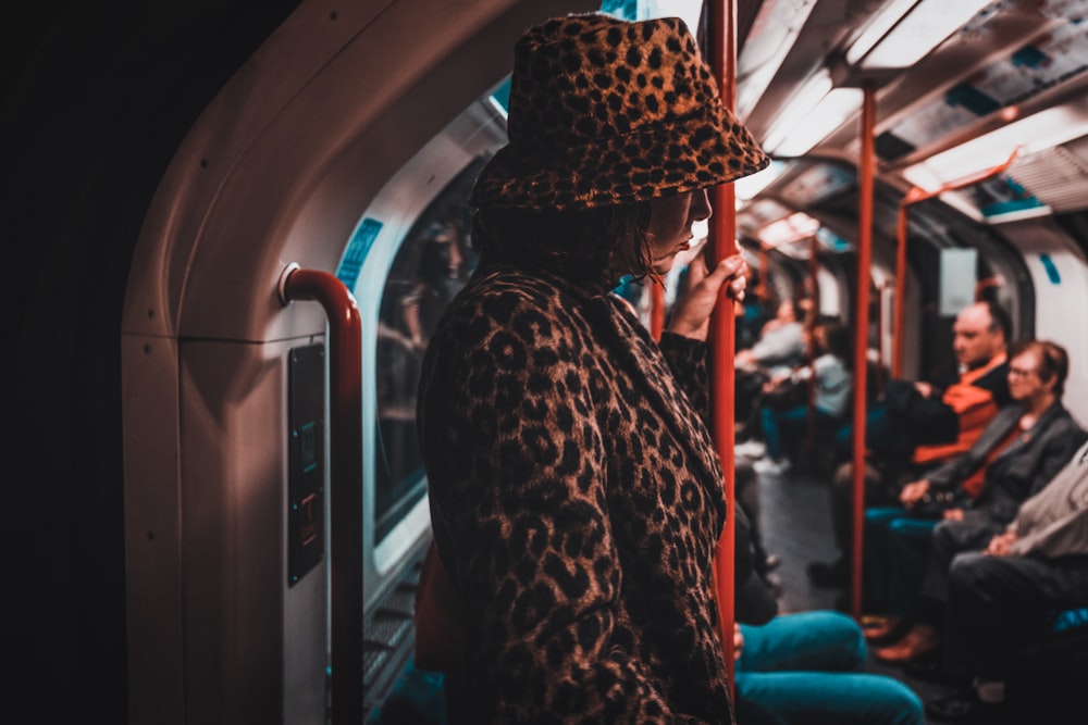 a person in a hat on a train