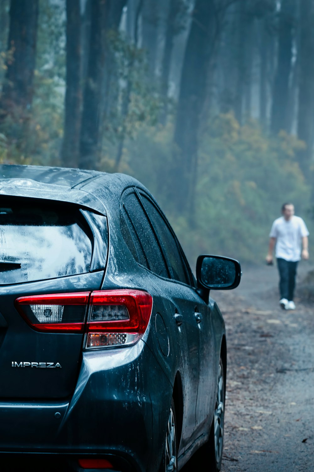 a black car parked on a road