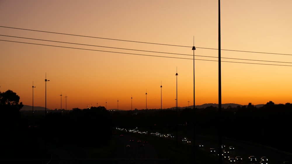 a sunset with many power lines