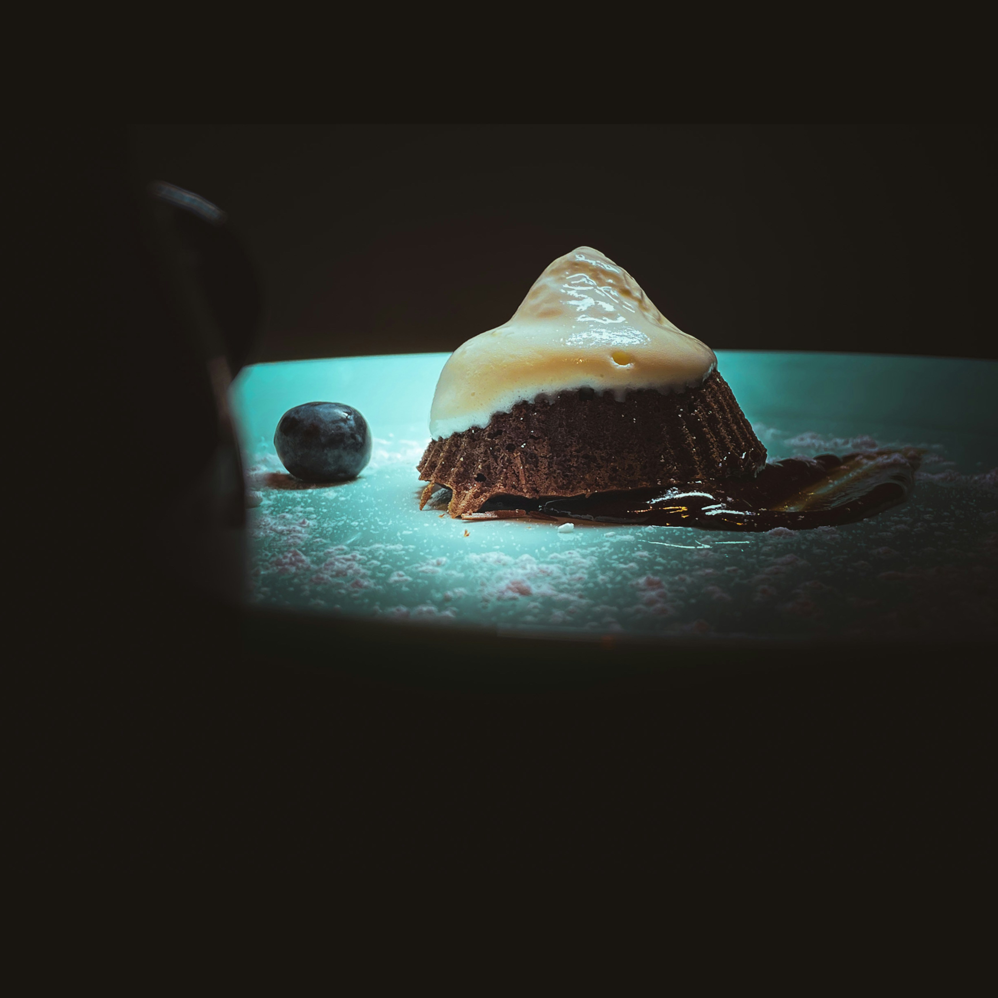 a slice of cake and a chocolate cake on a plate