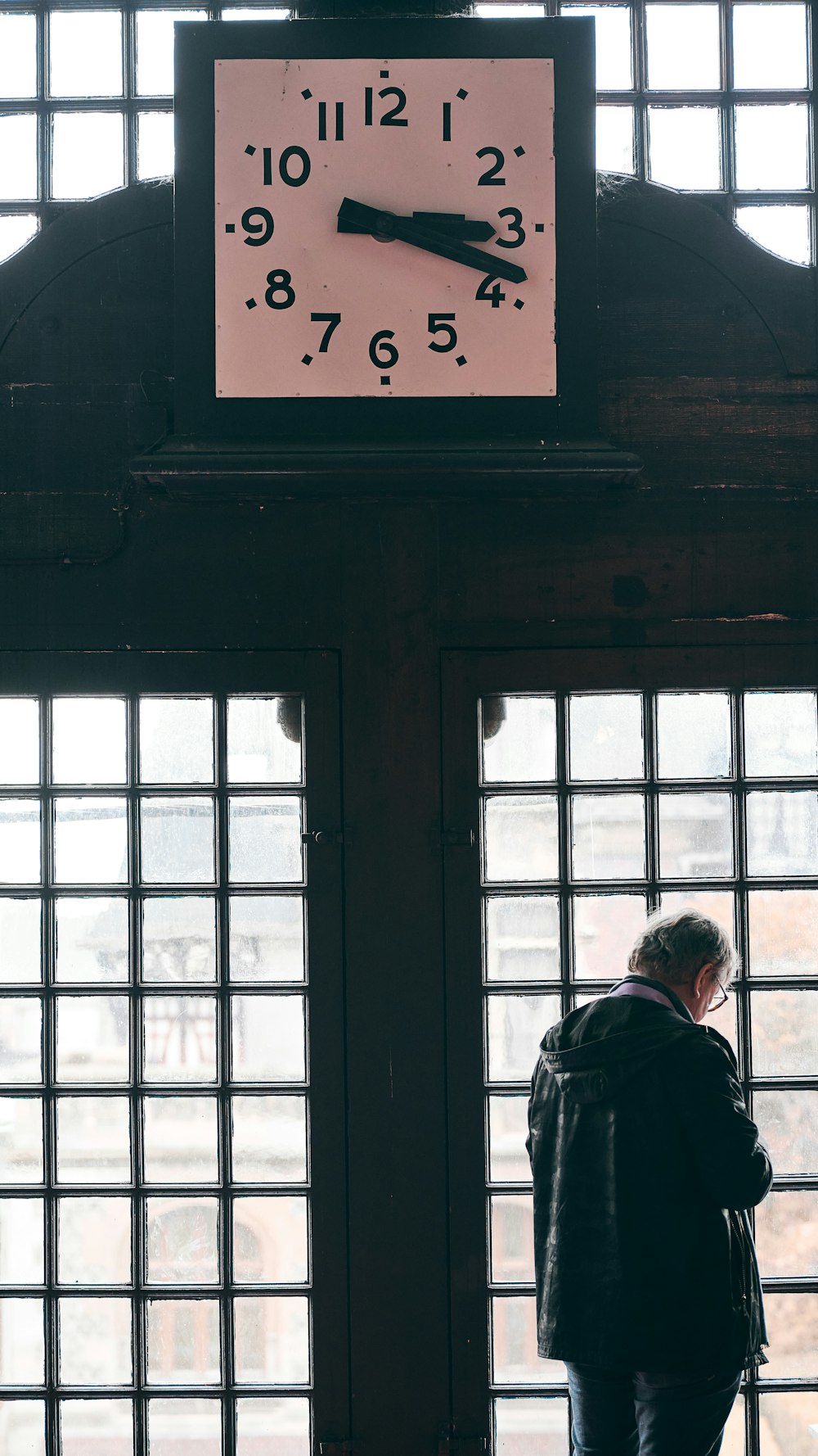 a person looking at a clock