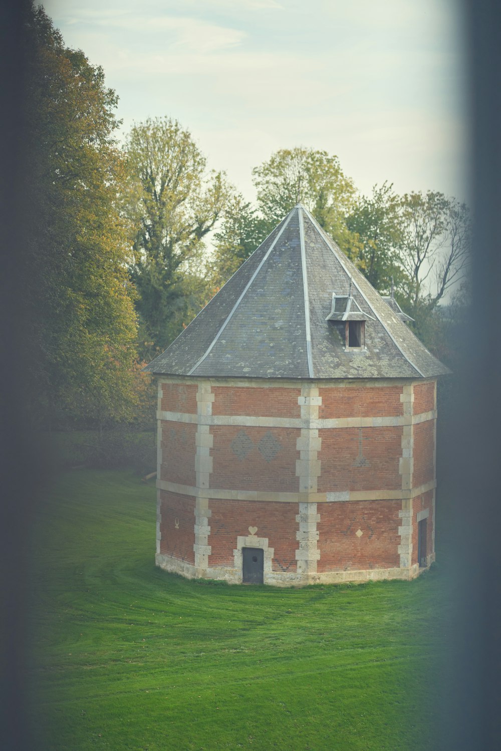 a brick building with a small tower