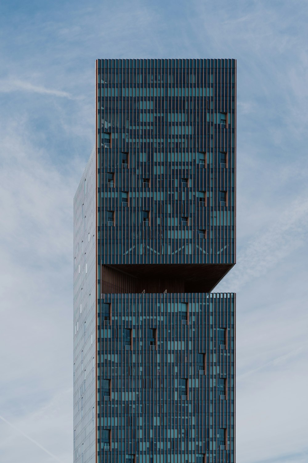 a tall building with a glass front