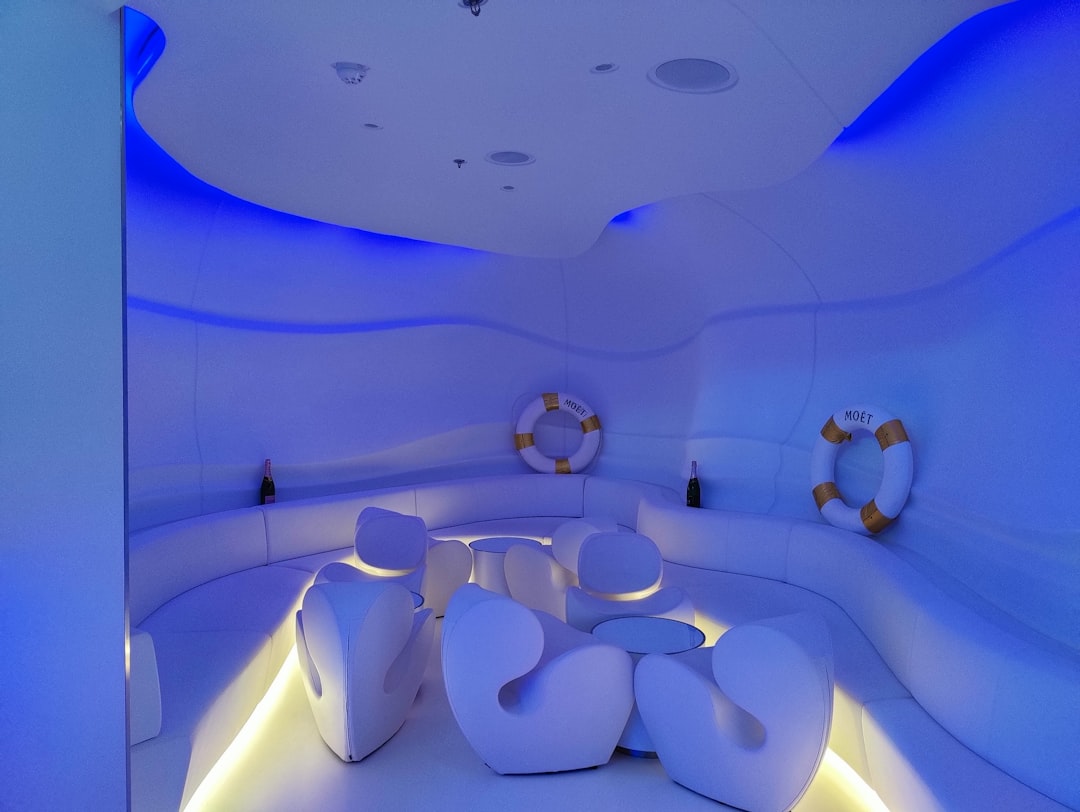 a room with a table and chairs,