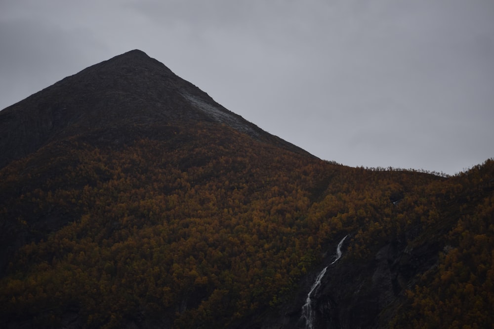 a mountain with a waterfall