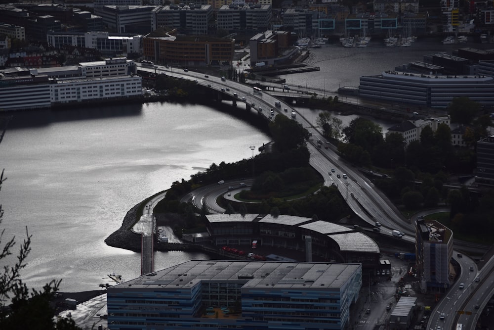 a river with a bridge and buildings