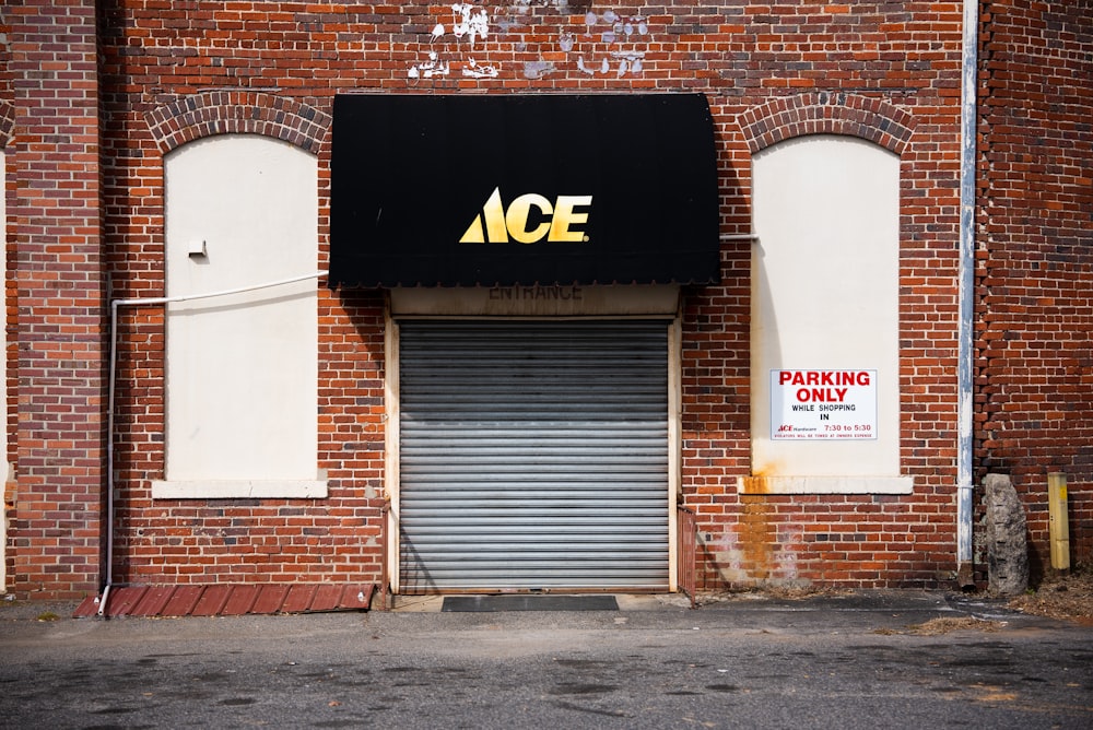 a brick building with a sign on it