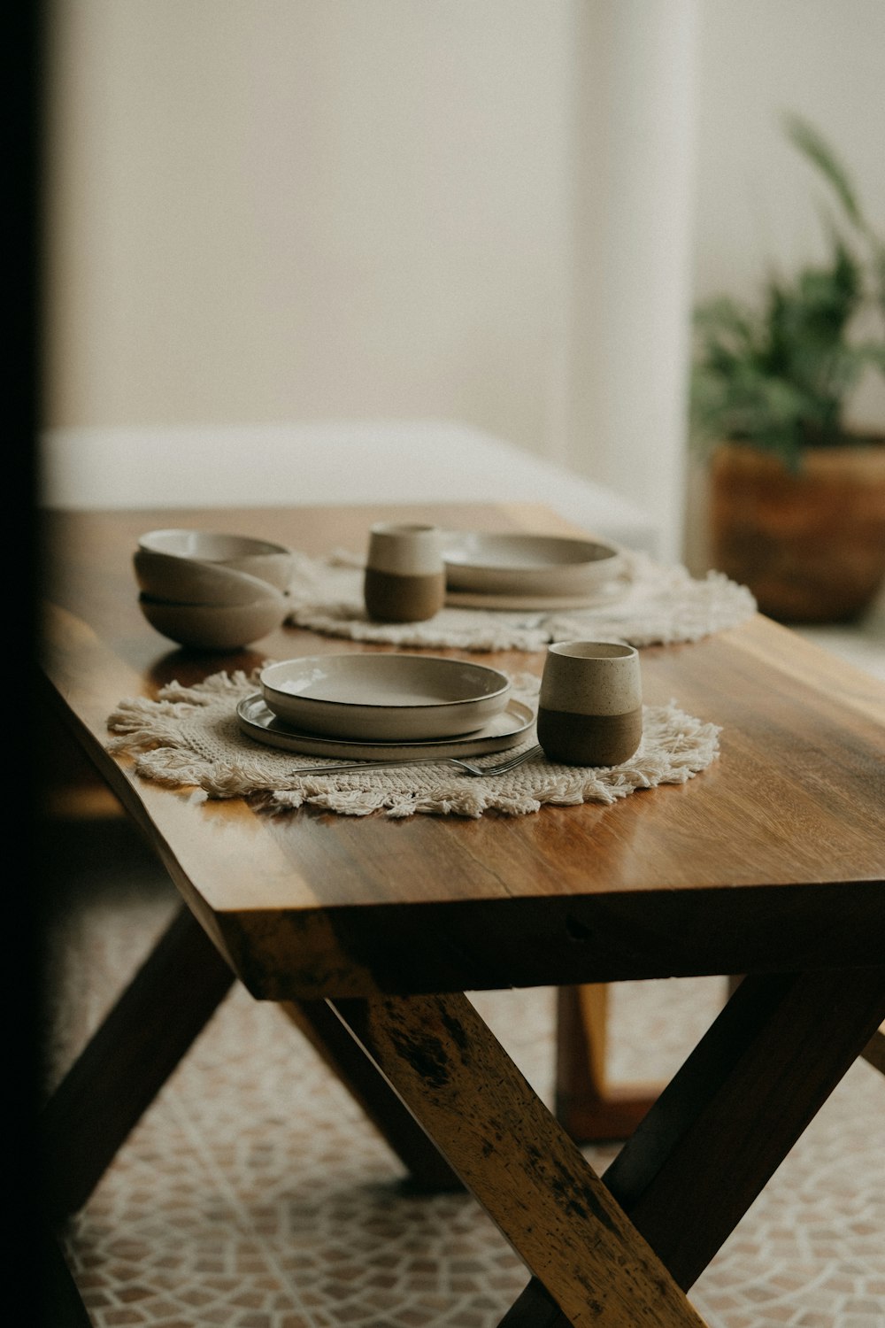 a table with plates and cups on it