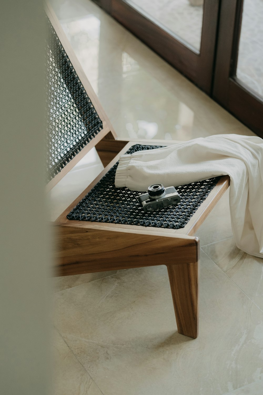 a table with a white cloth and a white pillow on it
