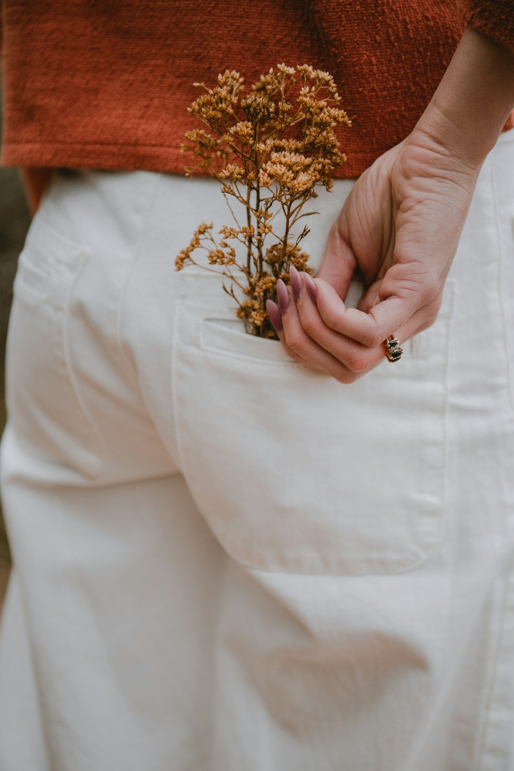 a person holding a flower