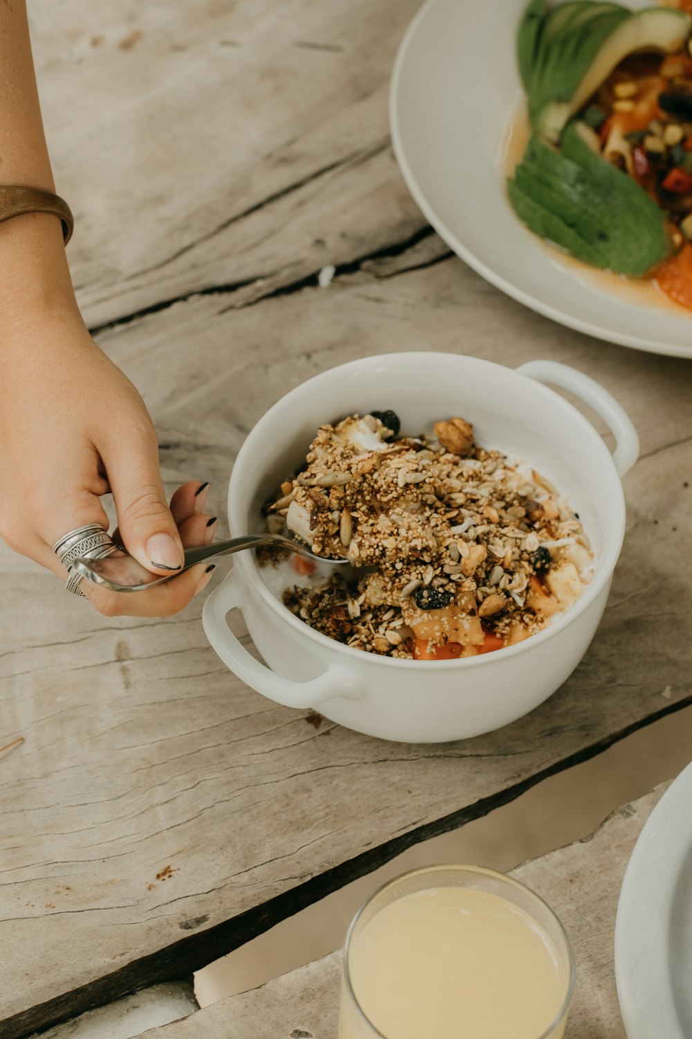 a person eating a bowl of food