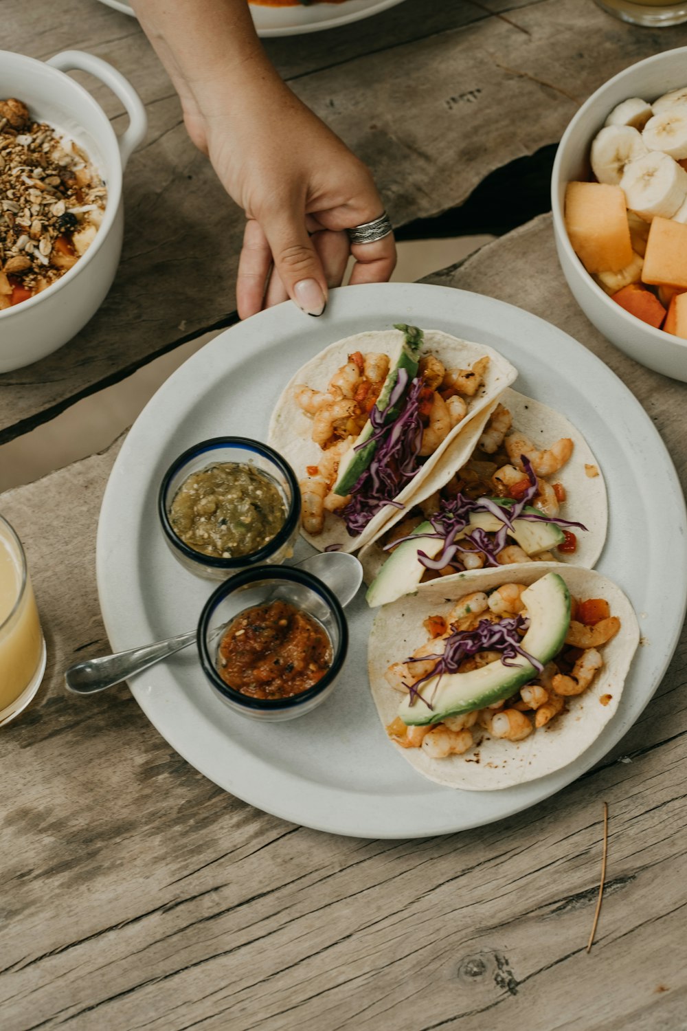 a person holding a plate of food