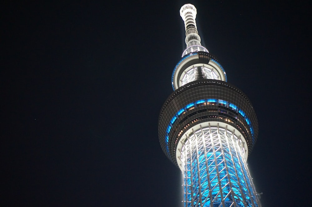 a tall pointy tower with lights