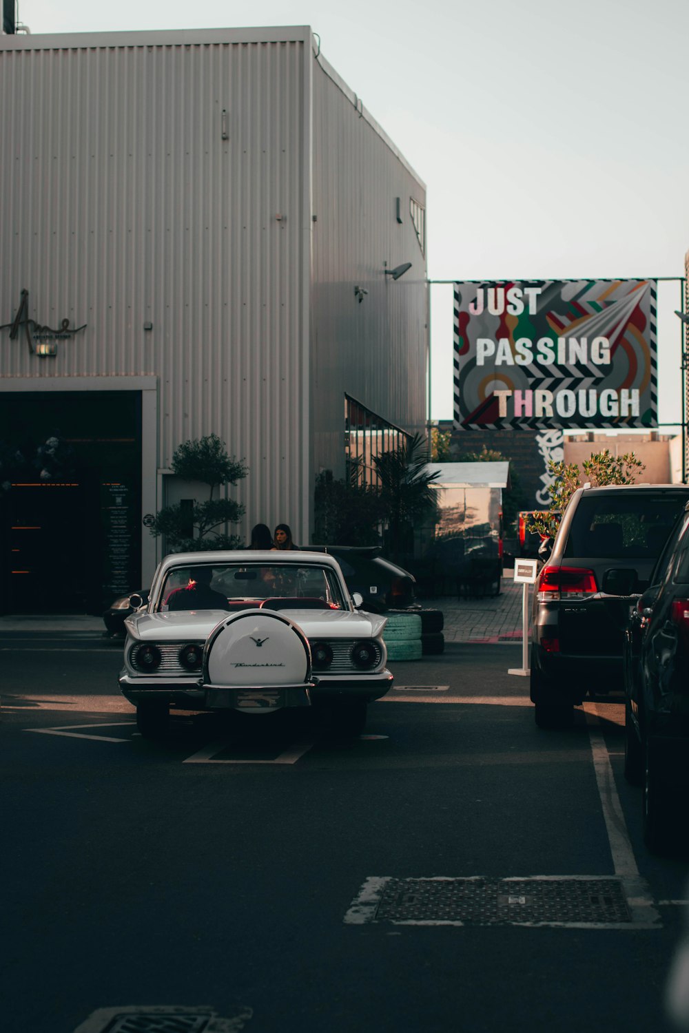 a car with a cartoon character on it parked in front of a building