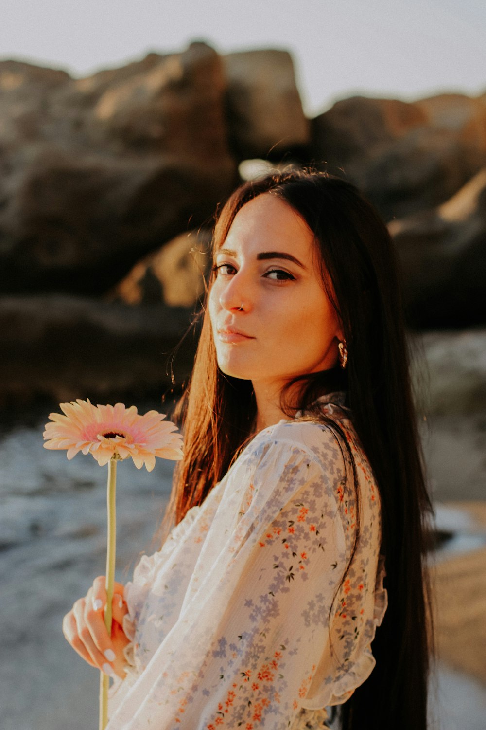 a woman with a flower in her hair