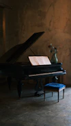 a piano with a vase of flowers