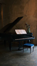 a piano with a vase of flowers