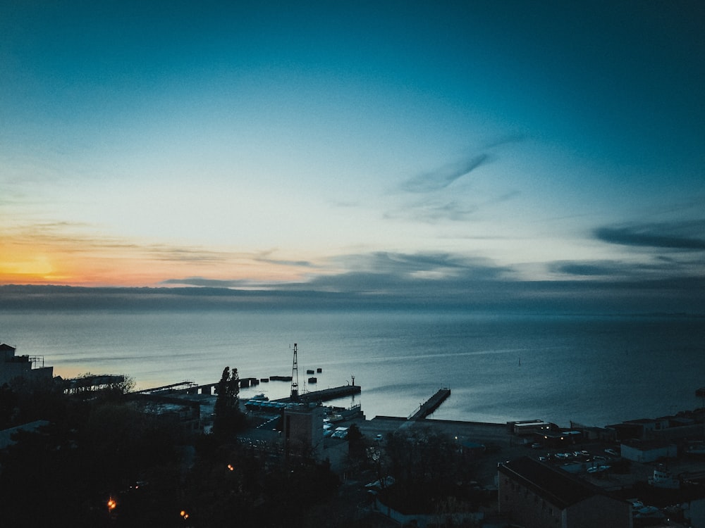 a city with a body of water in the background