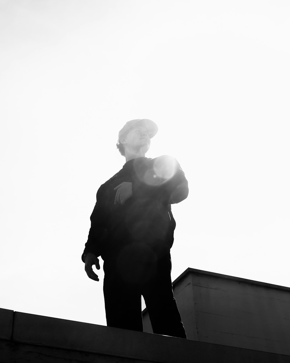 a man standing on a roof