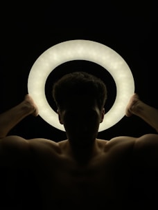 a person holding a light bulb