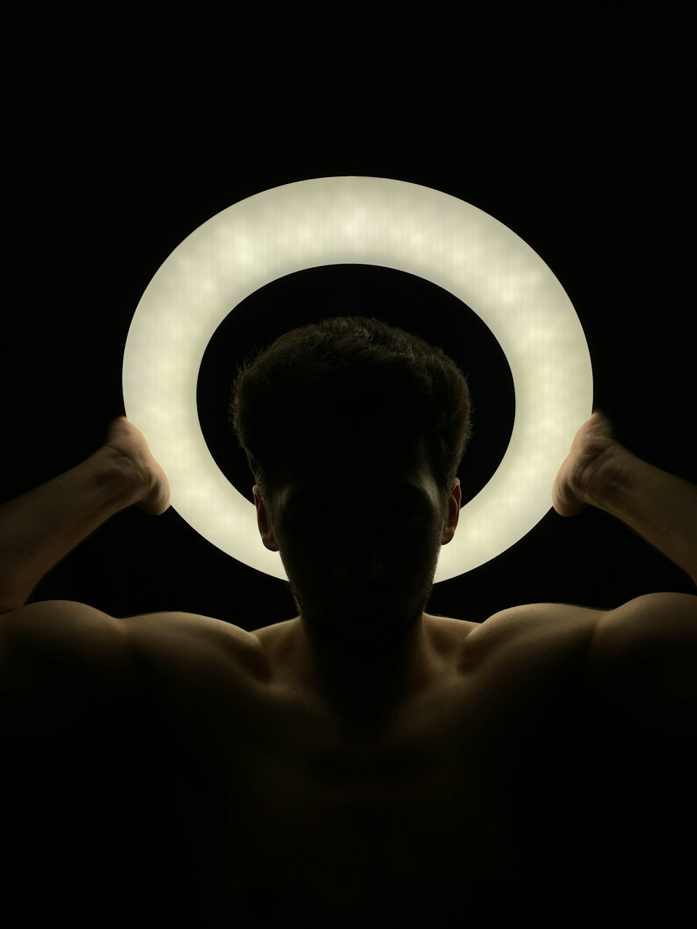 a person holding a light bulb