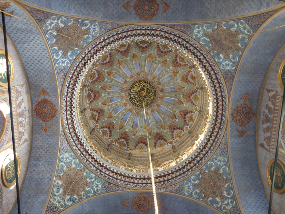 a domed ceiling with a gold design