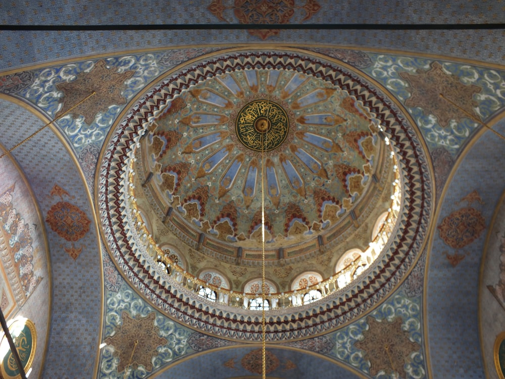 a domed ceiling with a gold design