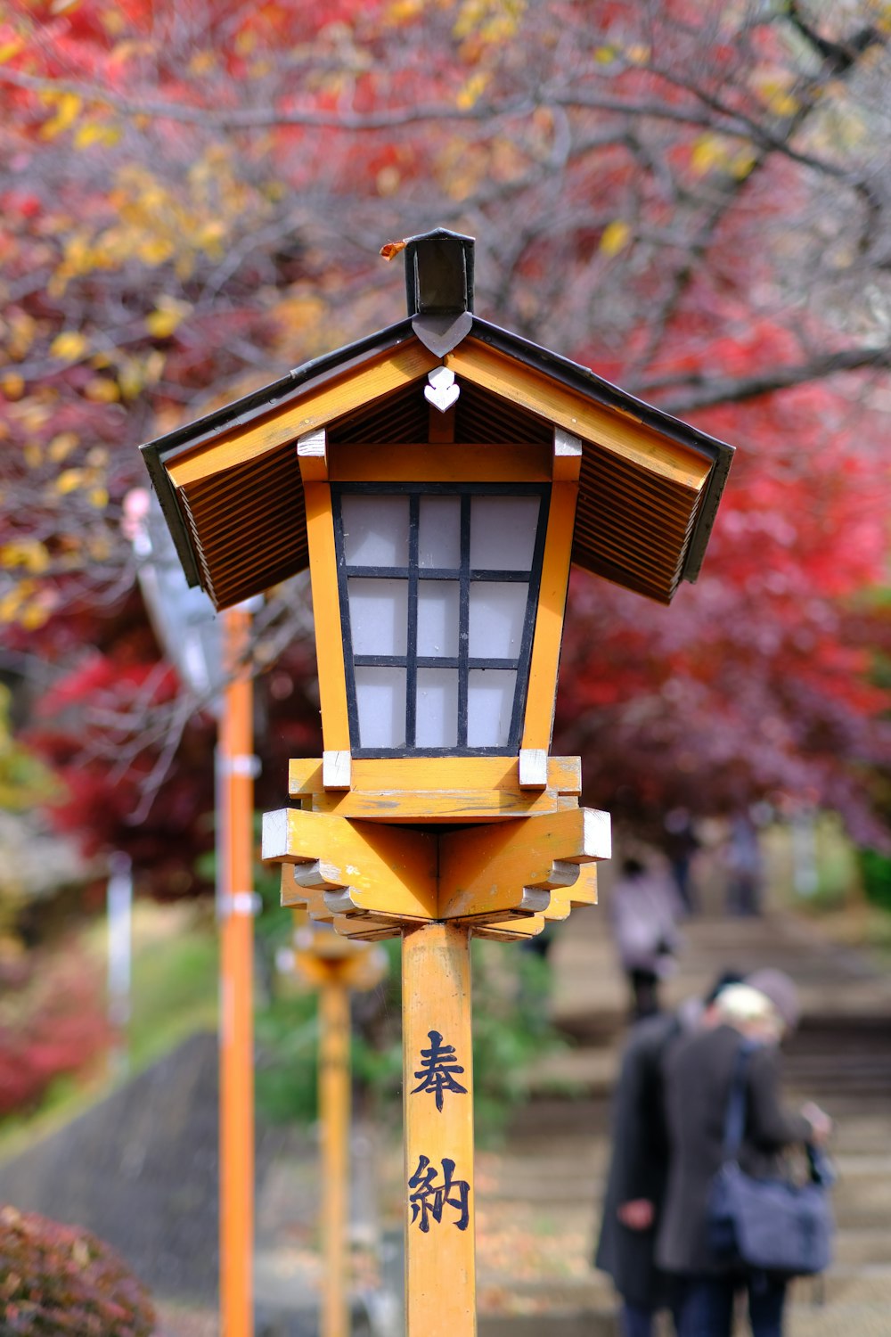 a yellow bird house