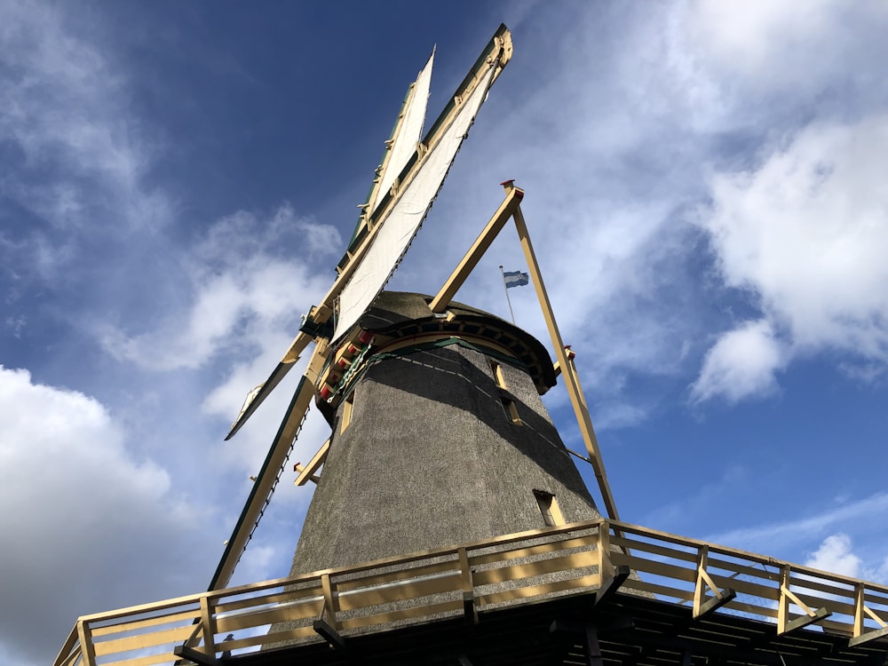 a large windmill with a blue sky