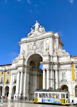a large building with a statue on top of it