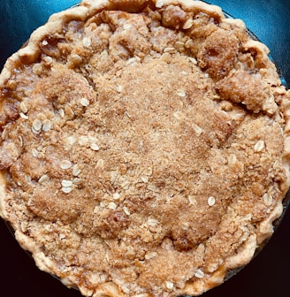 a brown pastry with white powder on it