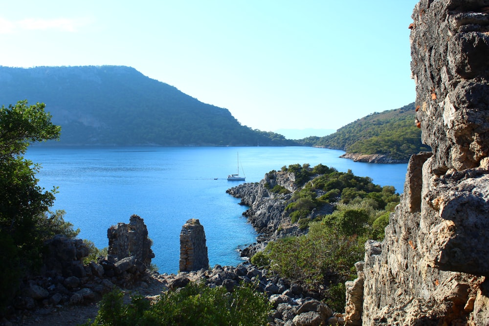 a rocky cliff overlooking a body of water