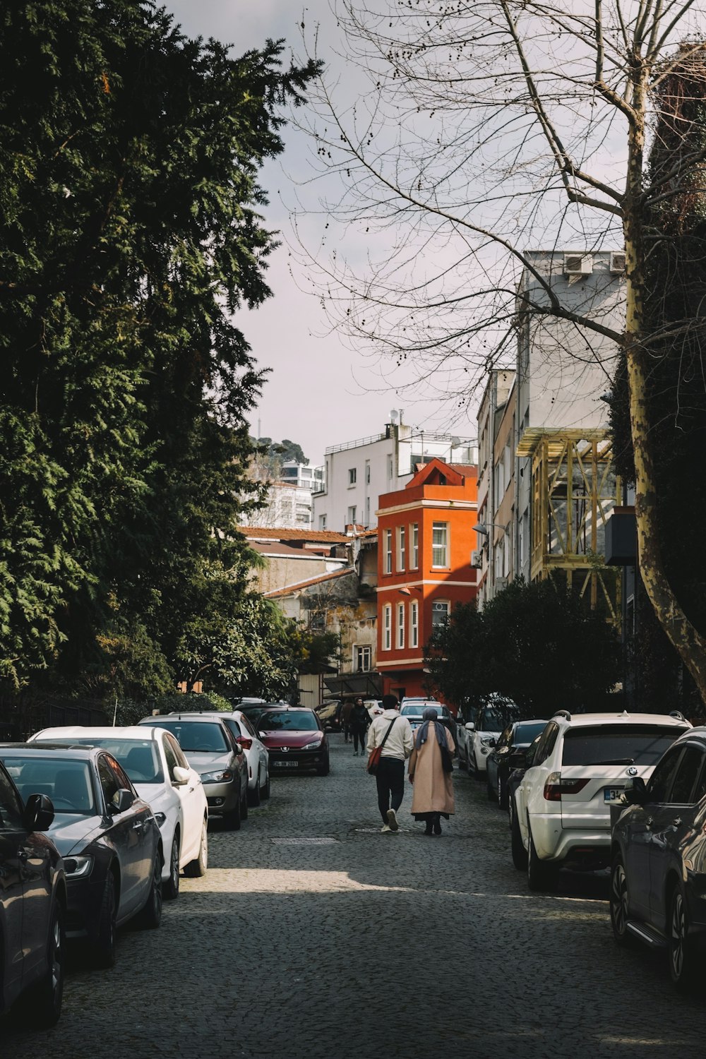 a couple walking down a street